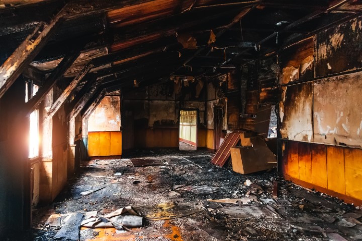 Burned Interiors After Fire In Industrial Or Office Building. War Or Fire Consequences Concept